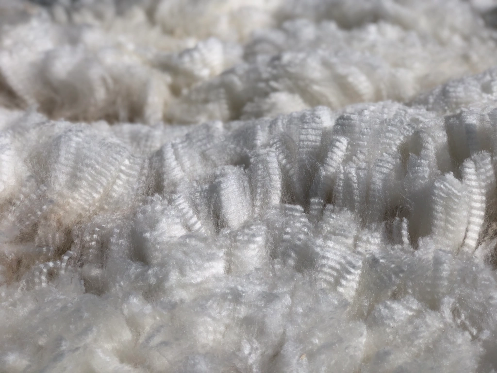 Close-up of textured white fleece material